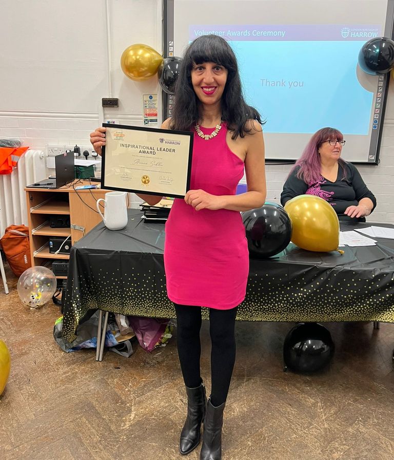Aruna receiving her award