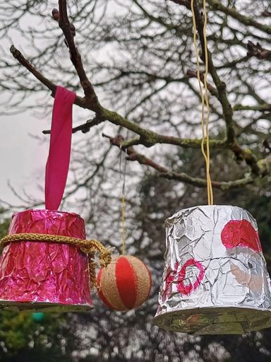 cartoon image of children with magnifying glass and bugs
