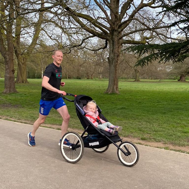 runner pushing child in buggy