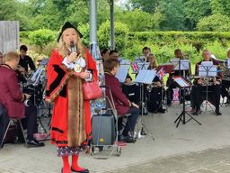 Harrow Mayor speaking in front of Grimsdyke Brass band